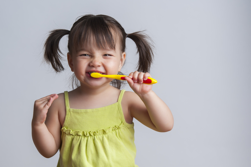How to Begin Teaching Your Child to Brush Her Teeth